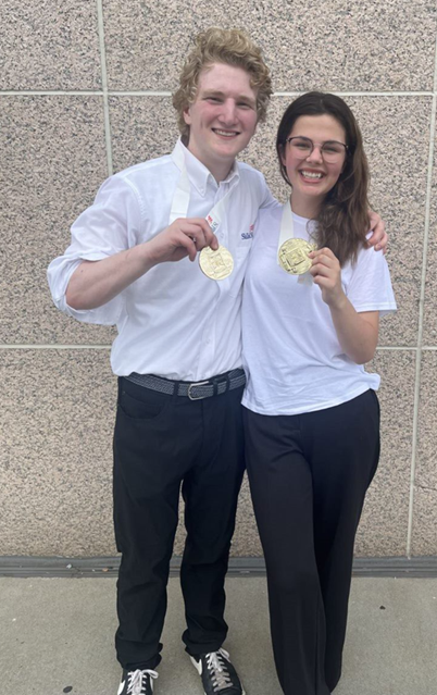 Charlie Salowich, left, and Madeleine White win gold at the National SkillsUSA Competition in Atlanta.